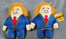 Two "The Dognald" Dog Toys